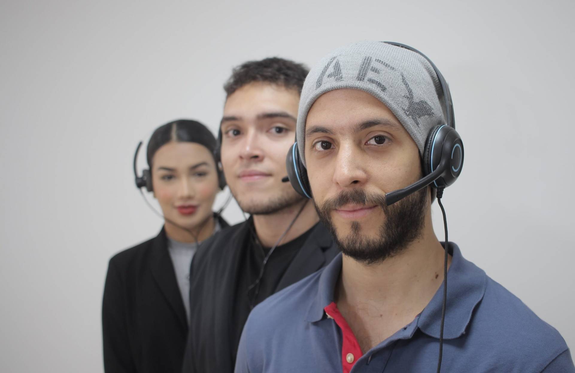 Focused man with his work team Call center team with one person focused